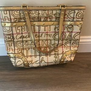Original cream colored coach purse with gold accent